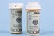 Two pill bottles wrapped in 20-dollar bills [Image by creator Karen Roach from AdobeStock]