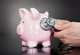 Piggy bank with stethoscope [Image by creator Andrey Popov from AdobeStock]