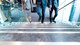 Business people walking up a contemporary staircase [Image by creator metamorworks from AdobeStock]