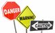 Danger, warning, and caution roadsigns [Image by creator iQoncept from AdobeStock]