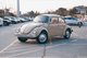 a taupe-colored Volkswagen parked poorly in a parking lot [Image by creator Pexels from Pixabay]